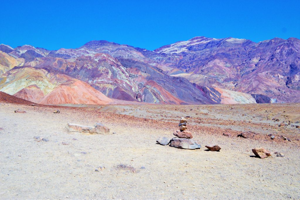 Stacked rocks in death valley artist paint pots, USA
