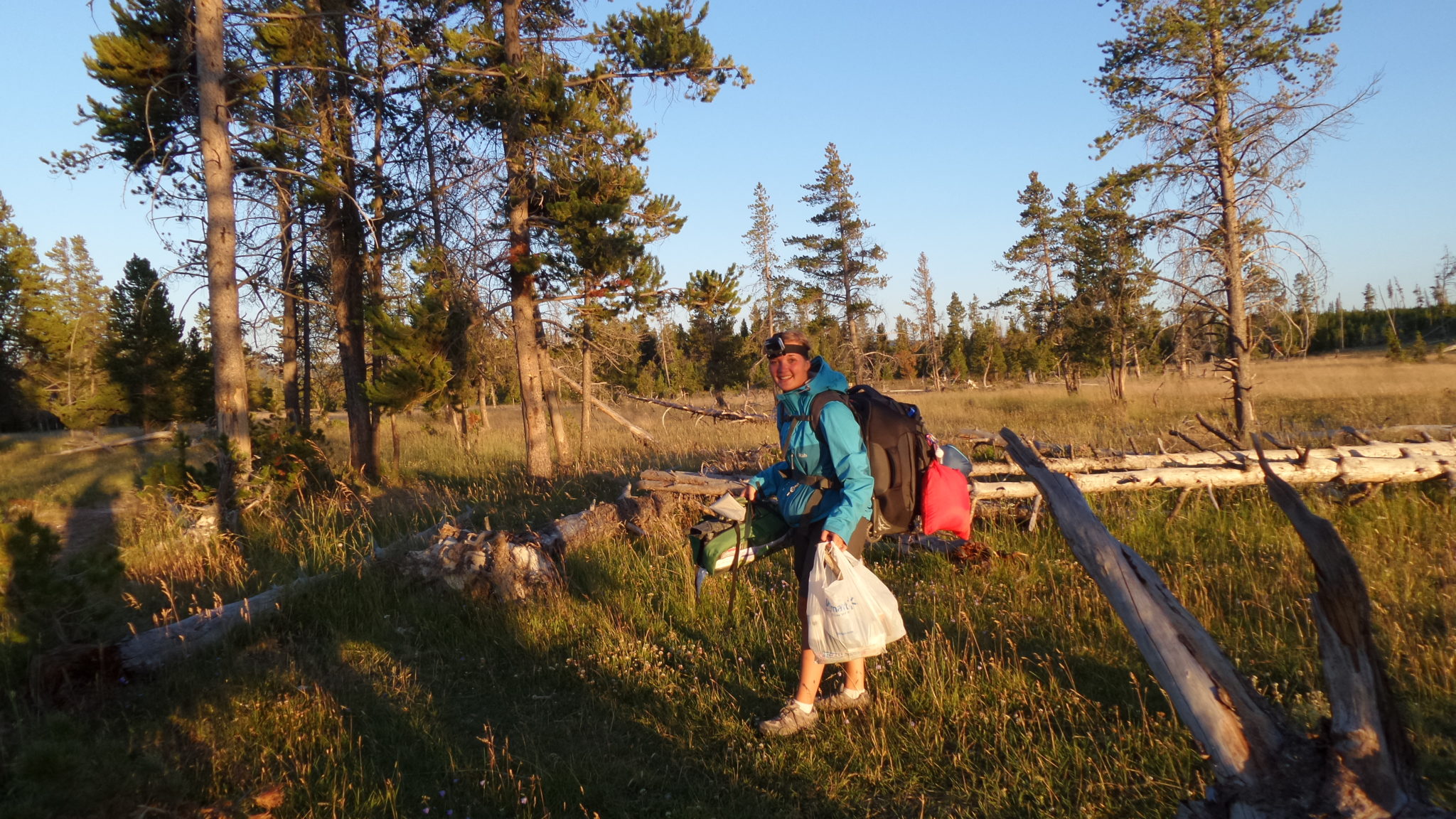 photograph of Hiking in Yellowstone National Park carrying camping equipment