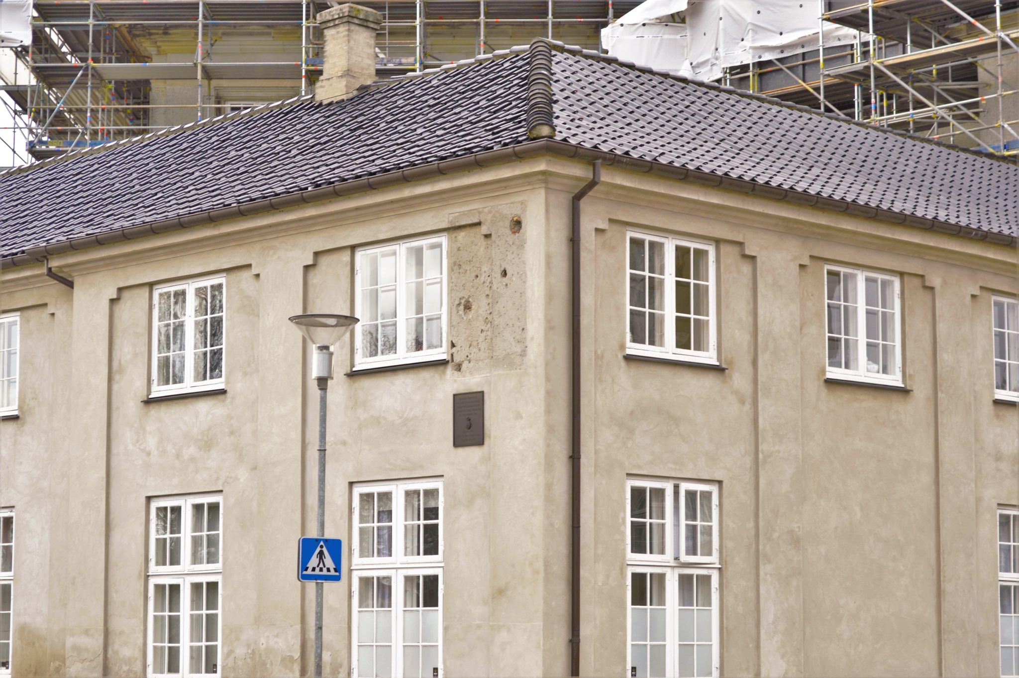 Bullet holes on building near Amalienborg Palace in Copenhagen, Denmark
