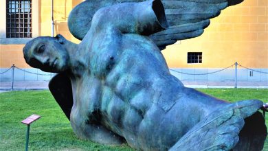 Fallen angel statue, Pisa, Leaning tower, Italy created by the Polish artist Igor Mitoraj