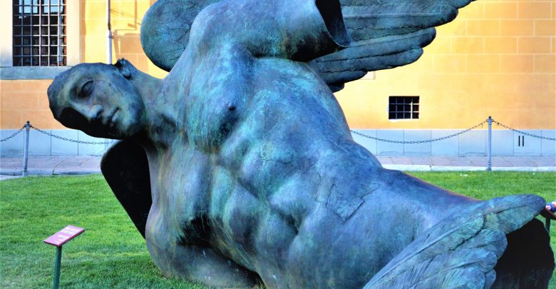 Fallen angel statue, Pisa, Leaning tower, Italy created by the Polish artist Igor Mitoraj
