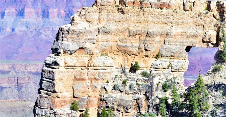 People walking on Angel's Window, Grand Canyon North Rim
