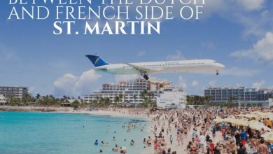 airplane flying over St.Martin beach