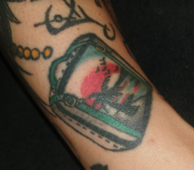 best suitcase travel tattoos