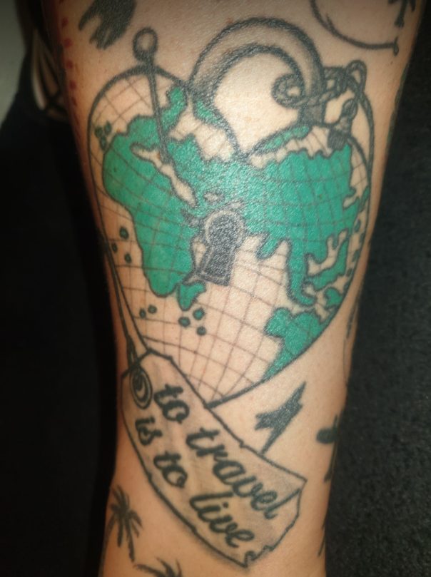 globe heart travel tattoo design