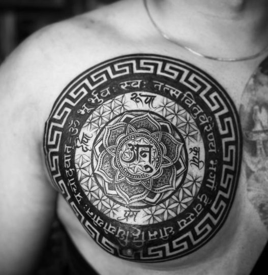 circle mandala om lotus chest tattoo