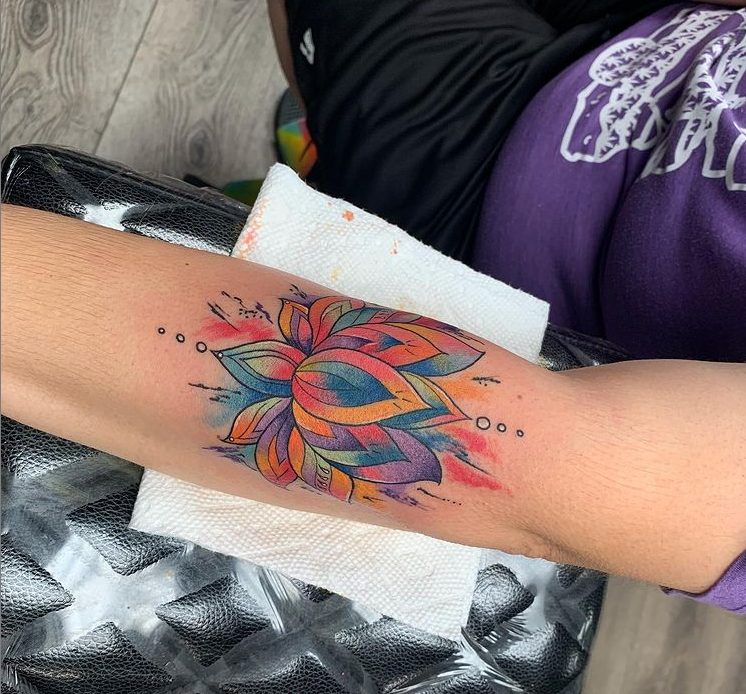 colorful lotus flower tattoo arm