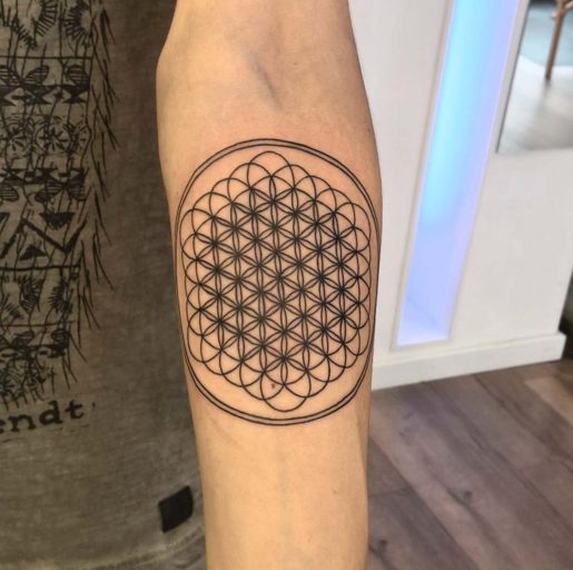 flower of life arm tattoo geometrical