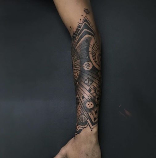 geometric spiritual forearm tattoo