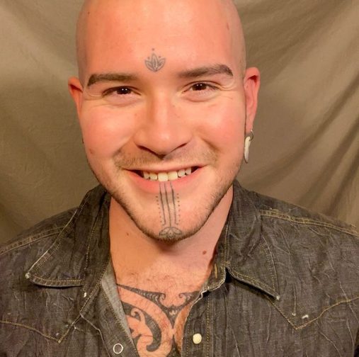 lotus flower and chin face tattoos spirituality