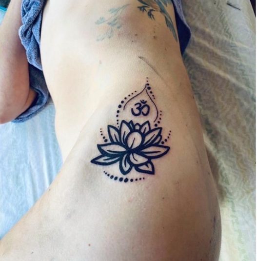 lotus flower side body spiritual tattoo
