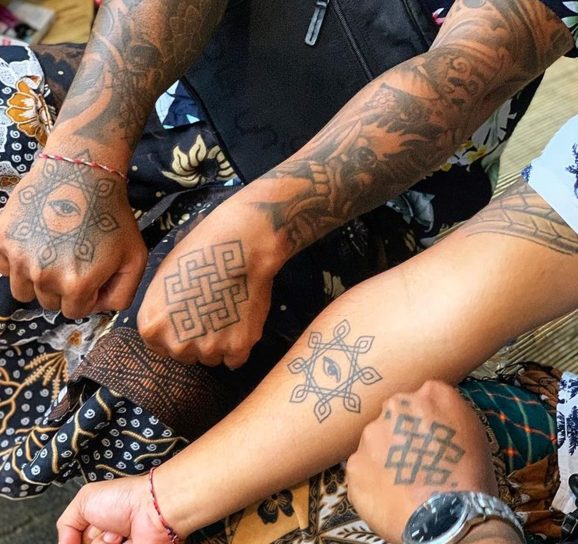 matching hand tattoos symbolic spiritual tribal