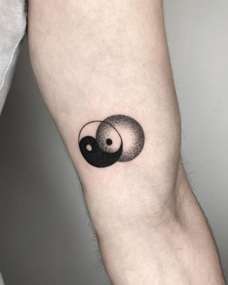 minimalist yin yang tattoo arm