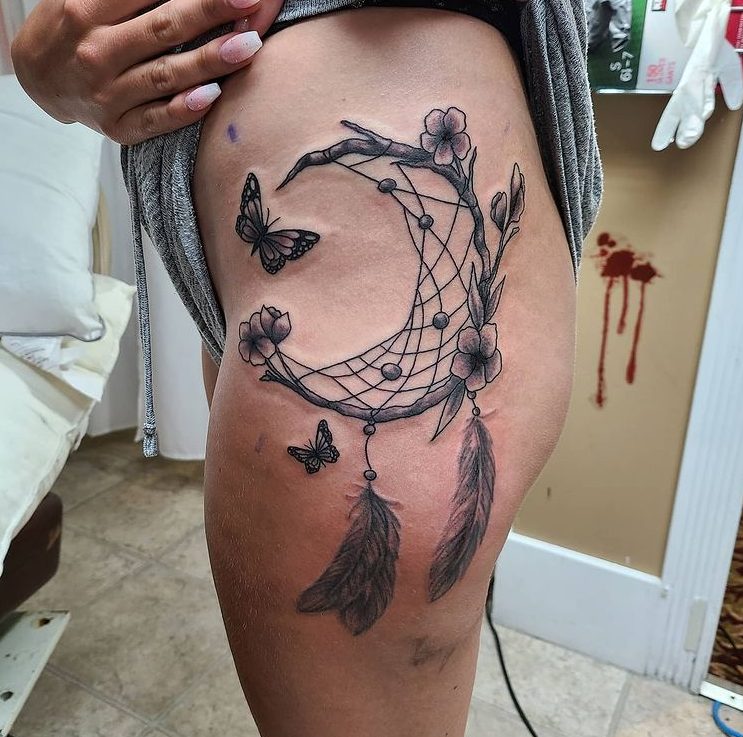 moon dreamcatcher butterfly thigh tattoo