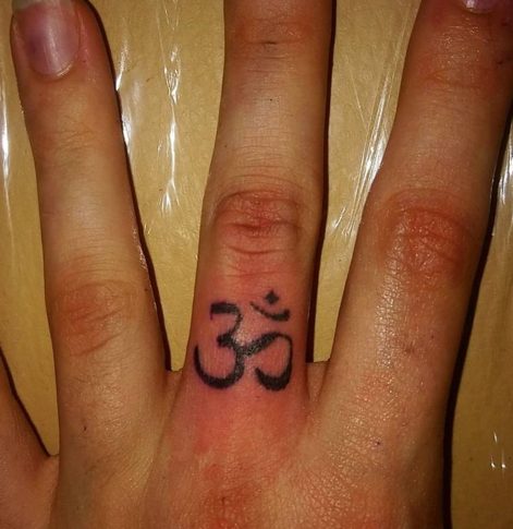 om finger tattoo symbol sanskrit meditation peace