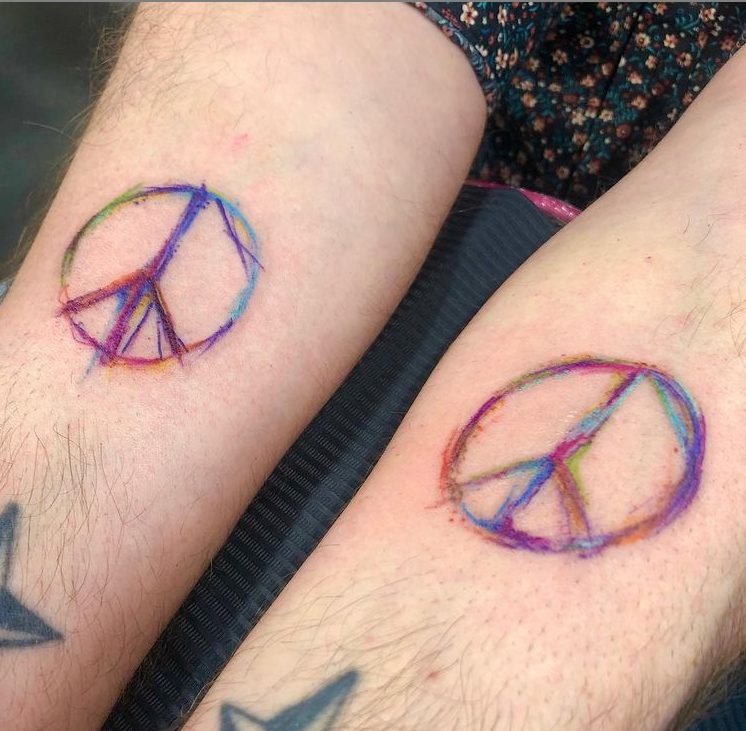 peace sign color matching tattoos