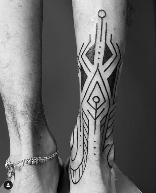 spiritual back of the leg tattoo tribal symbols