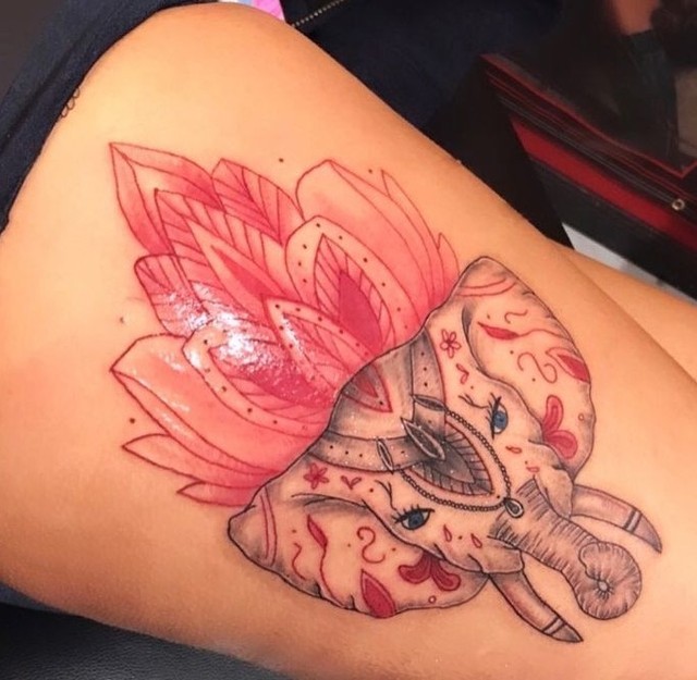 spiritual elephant tattoo with lotus flower thigh