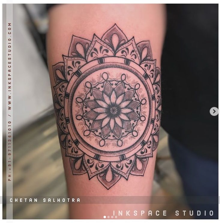 Spiritual tattoo of a mandala arm
