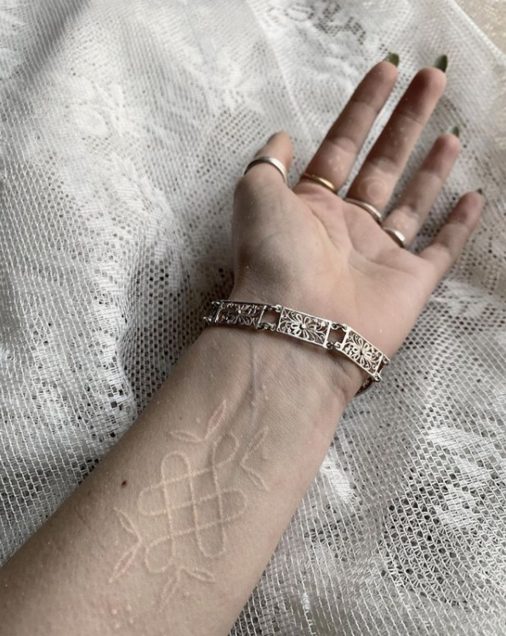 white celtic tattoo wrist spirituality
