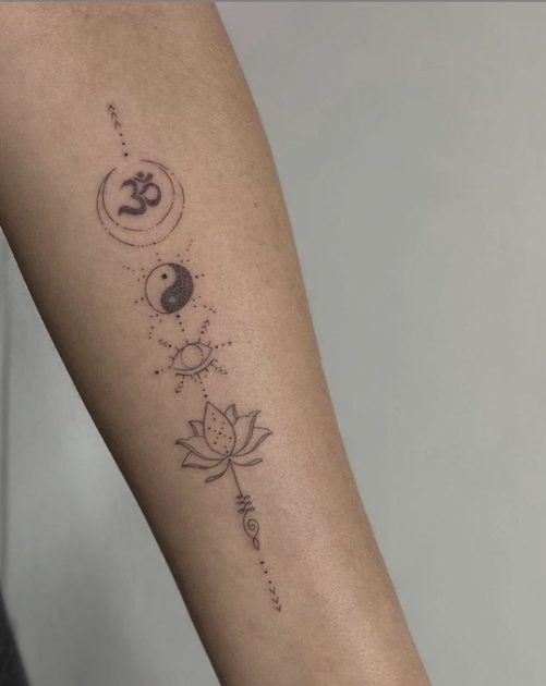 yin yang om lotus flower arm tattoo idea
