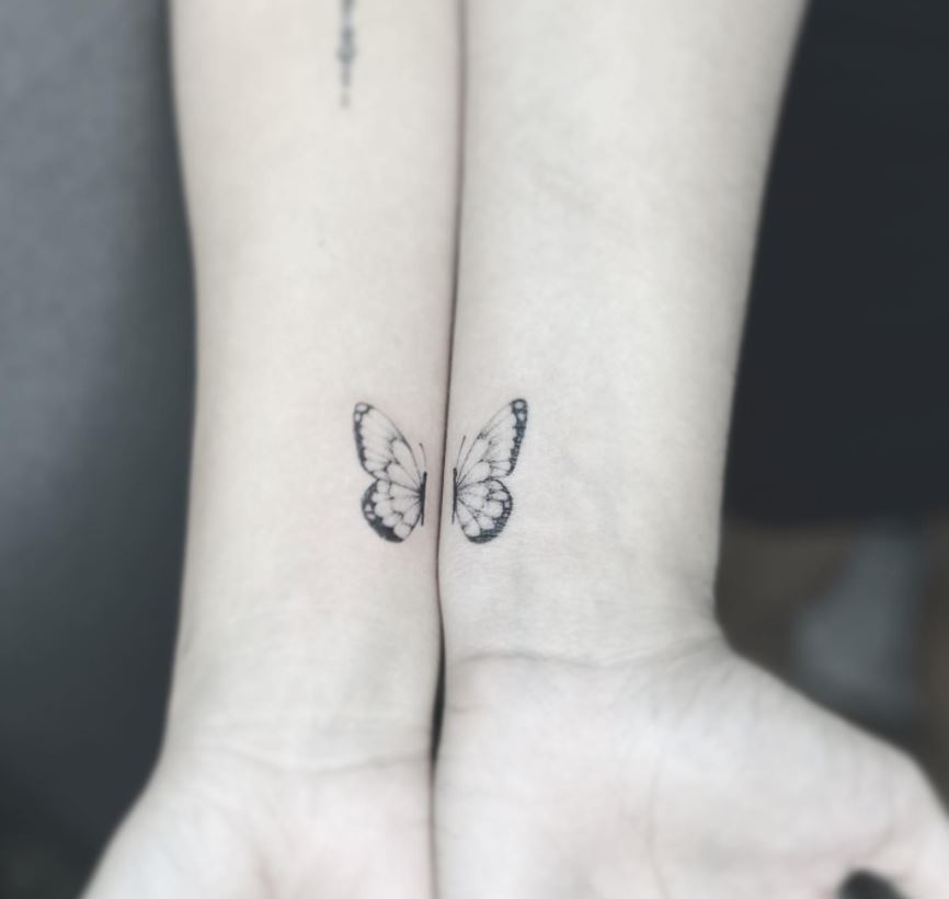 matching couple tattoo butterfly wings arm
