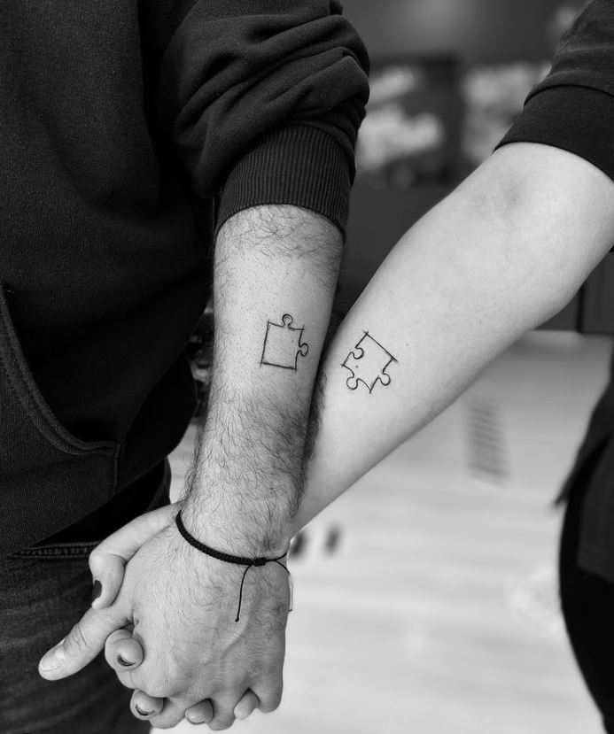 matching jigsaw piece couple tattoo