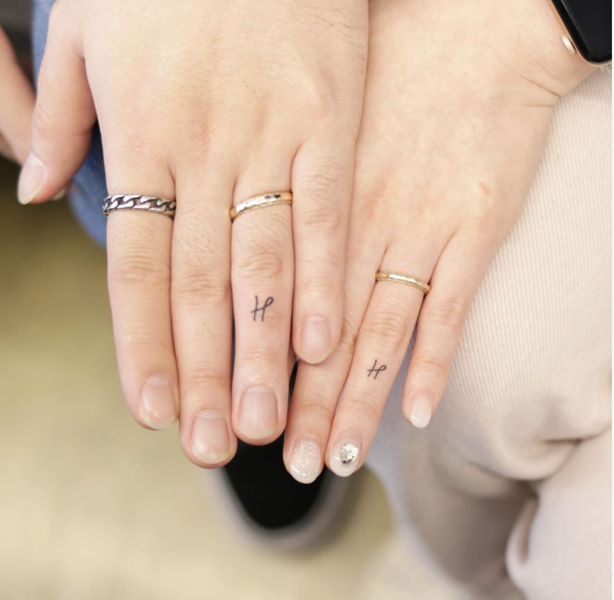 matching ring finger tattoos couple