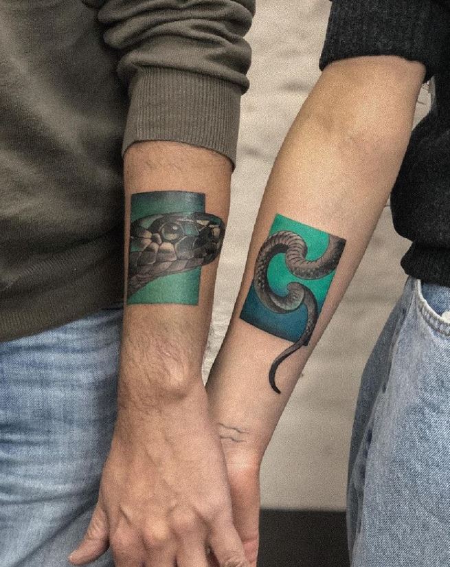 matching snake tattoos couple