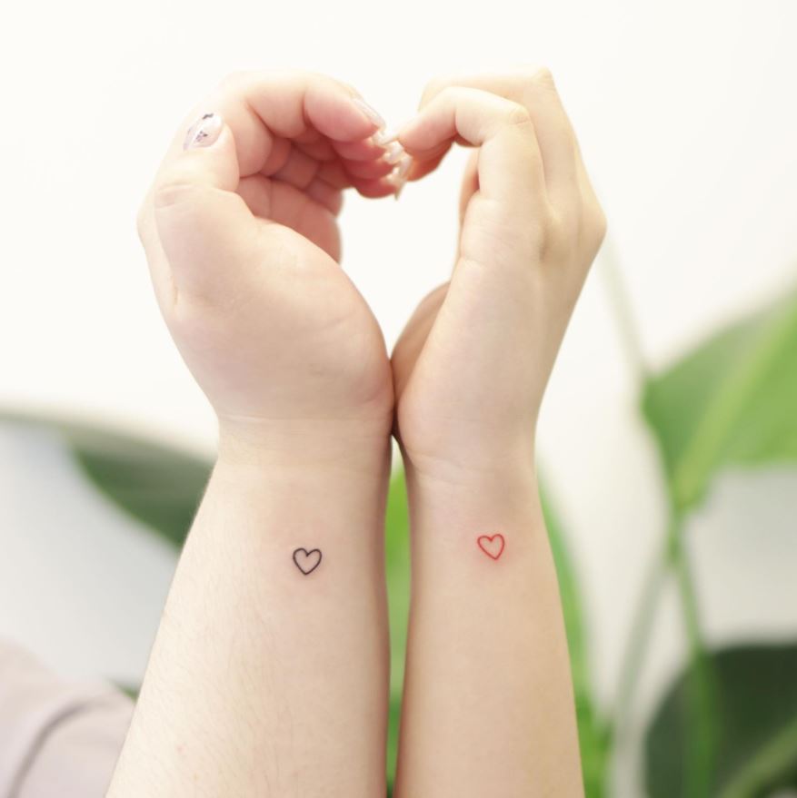 matching wrist heart tattoos