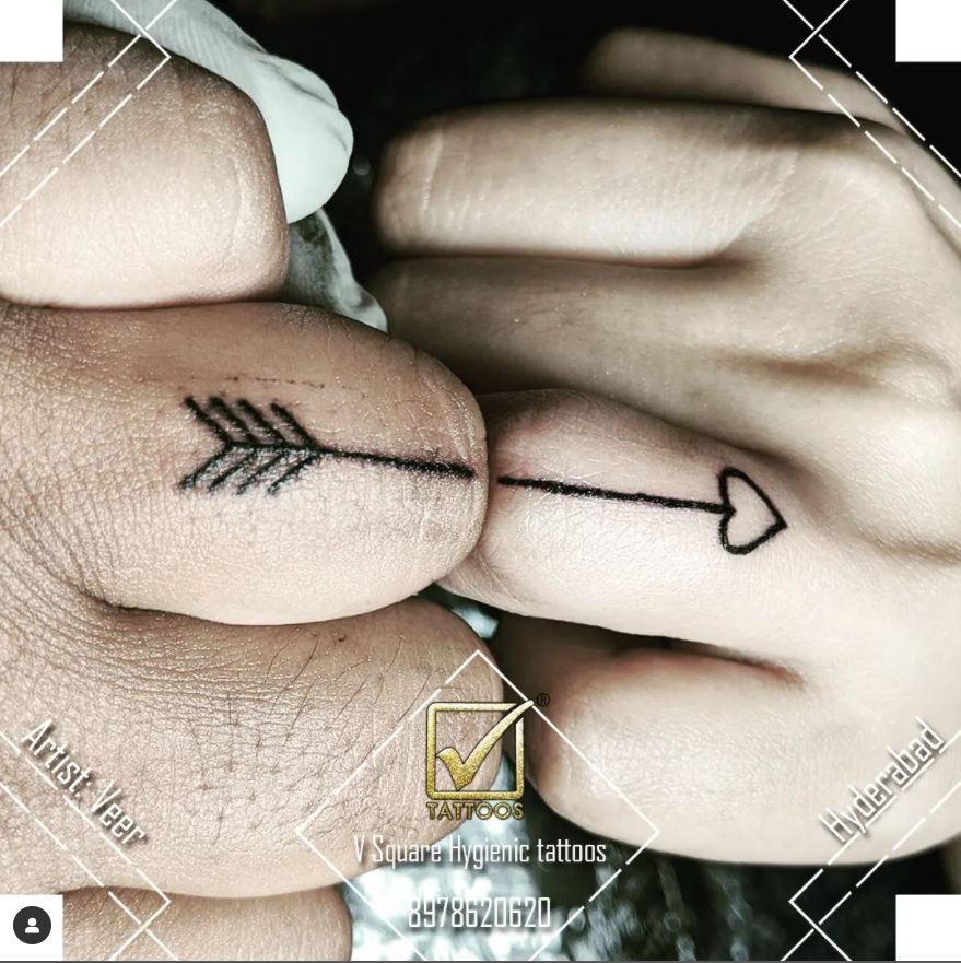 matching couple finger tattoo arrow
