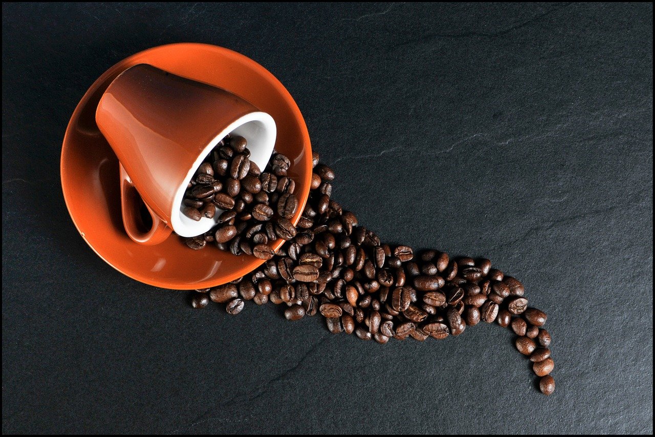 Coffee beans in a coffee cup